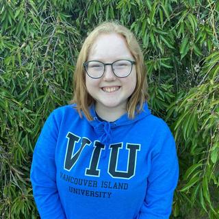Gill Maher wearing a VIU hoodie