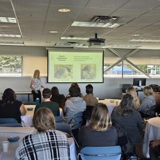 Student giving oral presentation at CREATE conference.