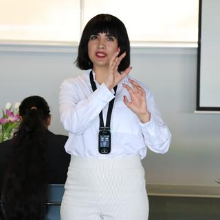 Student giving oral presentation at CREATE conference.