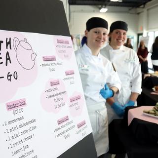 Culinary students showcasing baked goods at CREATE conference.